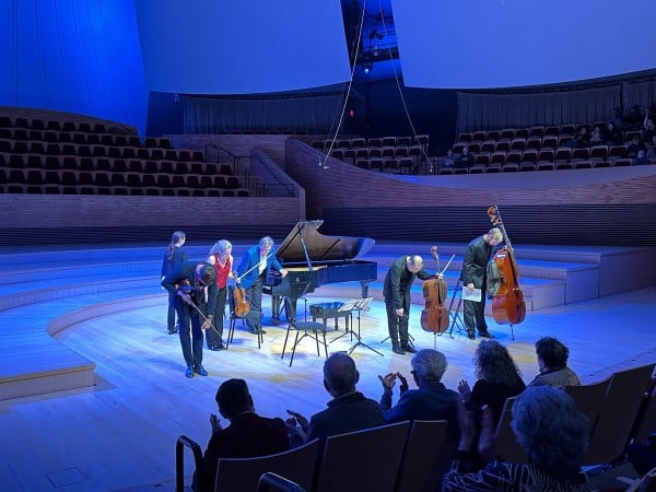 The St. Lawrence String Quartet bows before an audience in the blue-tinted Bing Concert Hall.