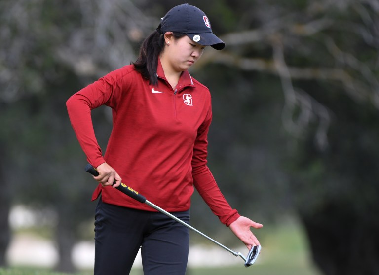 Rose Zhang holds a golf club