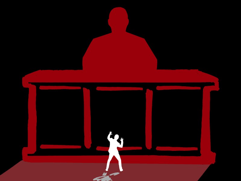 Outline of a person sitting behind a huge desk looking down on a small person raising their arms.