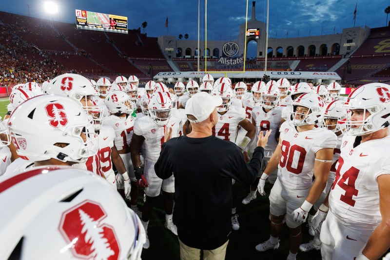 Stanford football team huddles around head football coach Troy Taylor before the game against USC last Saturday. (PHOTO: Bob Drebin/ISI Photos)