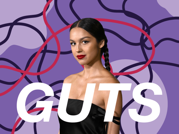 a graphic with the word "GUTS" overlaid on a photo of Olivia Rodrigo, who is a light-skinned feminine person with long straight black hair in a braid. the background is solid dark and light purple with curving black and red lines
