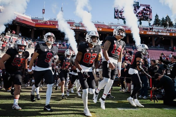 The Stanford football team runs out of the tunnel to play Washington. (Photo: CAYDEN GU/The Stanford Daily)