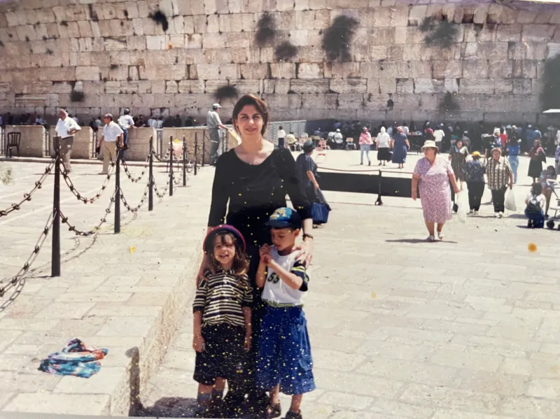 Author with brother and mom in front of the Western Wall in Jerusalem, 1998-1999. (Courtesy of Ben Schwartz)