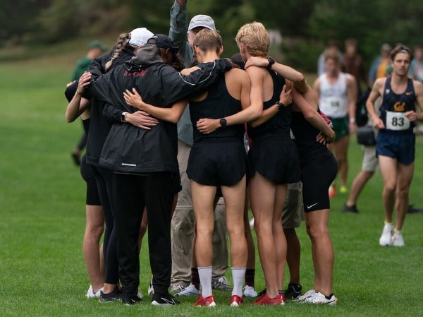 Stanford men’s cross country team huddle at a meet at Golden Gate Park on September 15, 2023 in San Francisco.