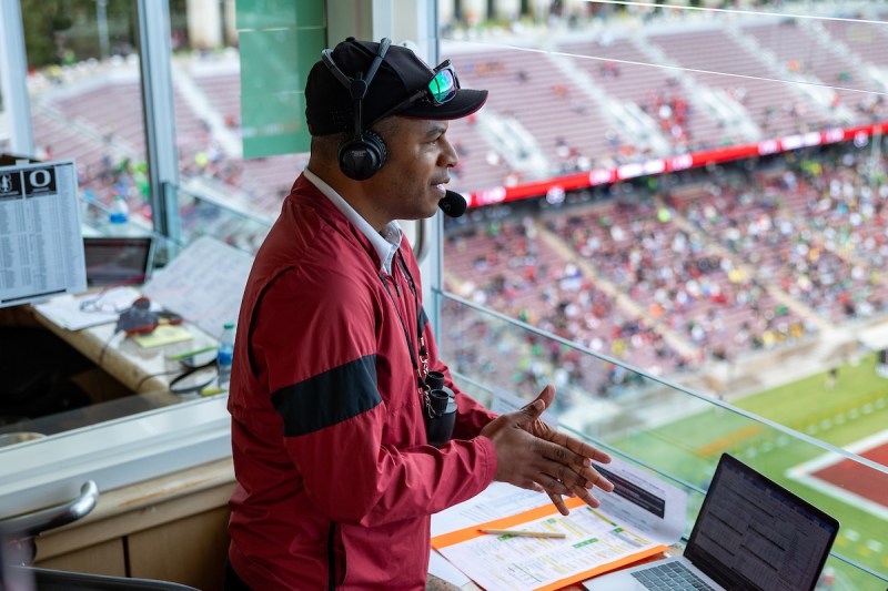 Troy Clardy announces from the press booth high above the field at Stanford Stadium.