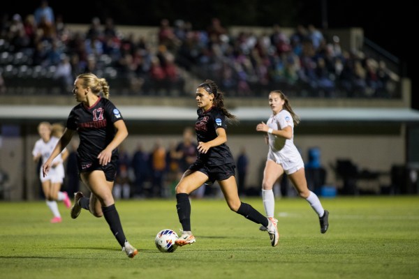 Stanford women soccer players chase after ball during a game against Pepperdine