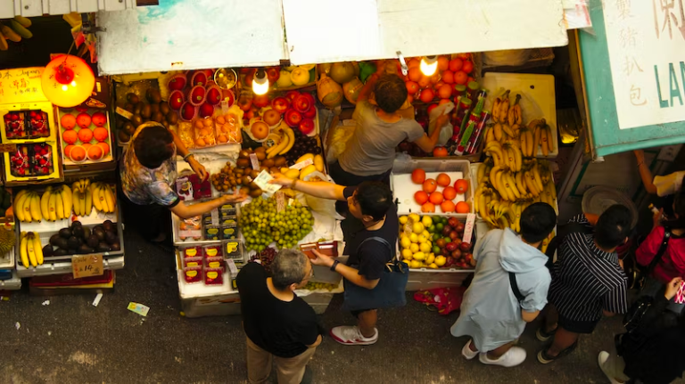 People buying groceries at a market