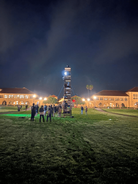 In the middle of the oval at 3 a.m., students gather around 8 dorm beds stacked on top of each other to create the "Octobunk."