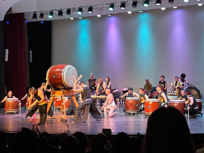Multiple performers on stage with Taiko drums.