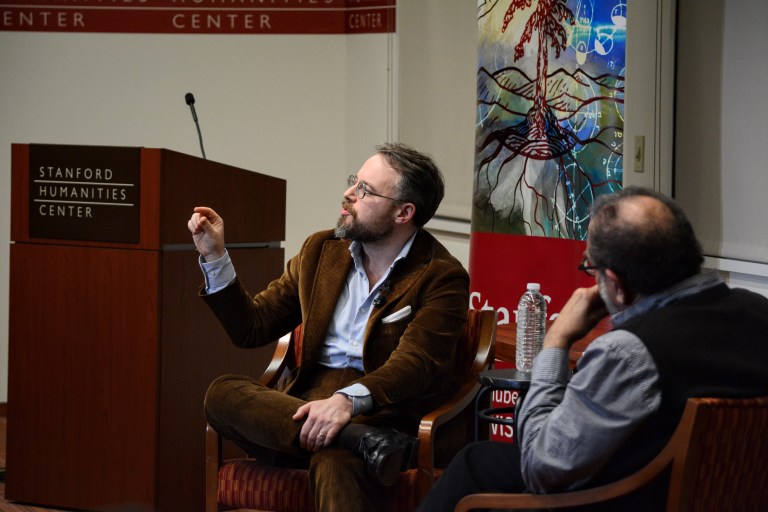 An author delivering a talk in the Stanford Humanities Center.