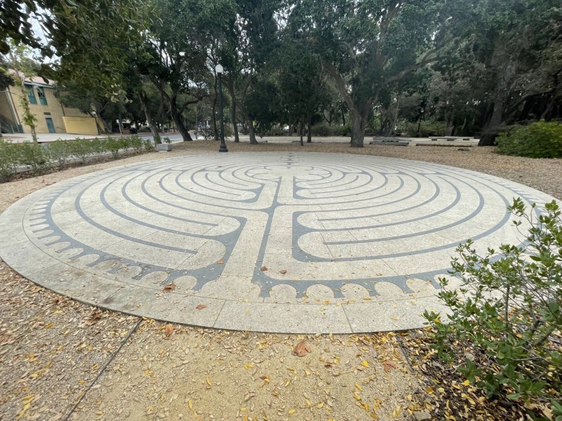 An image of the Windhover labyrinth (a flat circle with labyrinth designs on it.)
