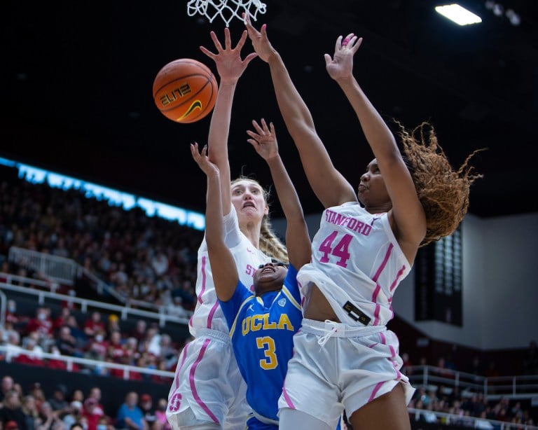 Senior forward Cameron Brink and junior forward Kiki Iriafen contest UCLA guard Londynn Jones's shot in the paint. (Photo: AL CHANG/ISI Photos)