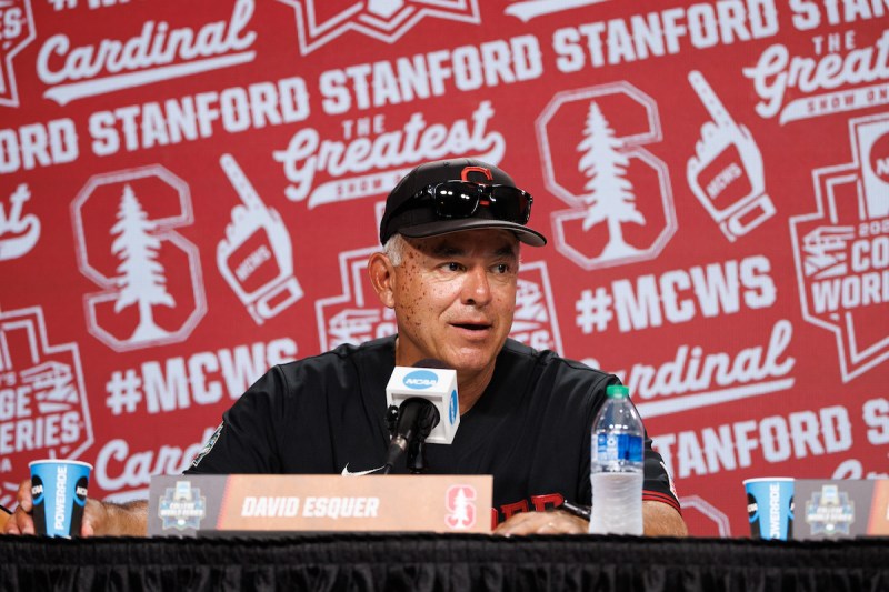 Stanford head baseball coach David Esquer '87 answers questions at a press conference after the Cardinal's loss to Tennessee during the College World Series. (Photo: Bob Drebin/ISI Photos)