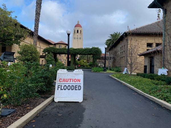 A picture of a "Caution: Flooded" sign in Main Quad.