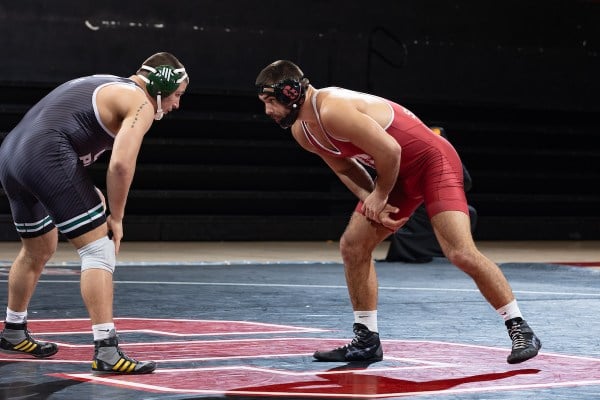 Nick Stemmet lining up against his opponent in a wrestling match against Cal Poly.