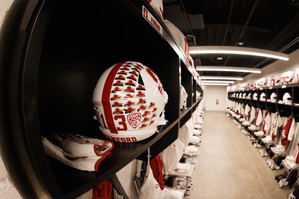 Stanford visiting locker room with a white and red helmet.