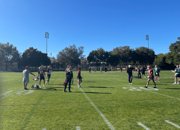Stanford football team warms up during practice practice.