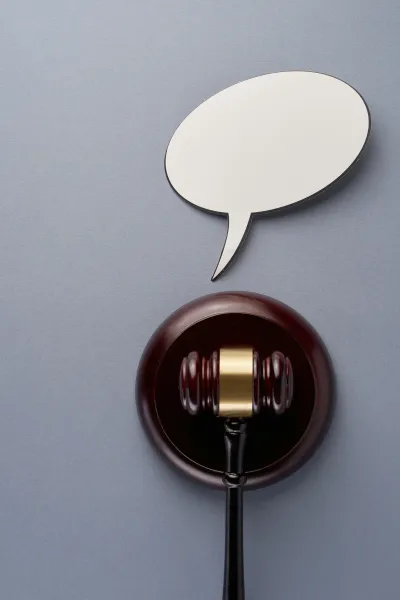 A speech bubble floating over a gavel