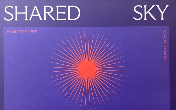 The poster for the Shared Sky Project, featuring an orange eclipse over a purple background.