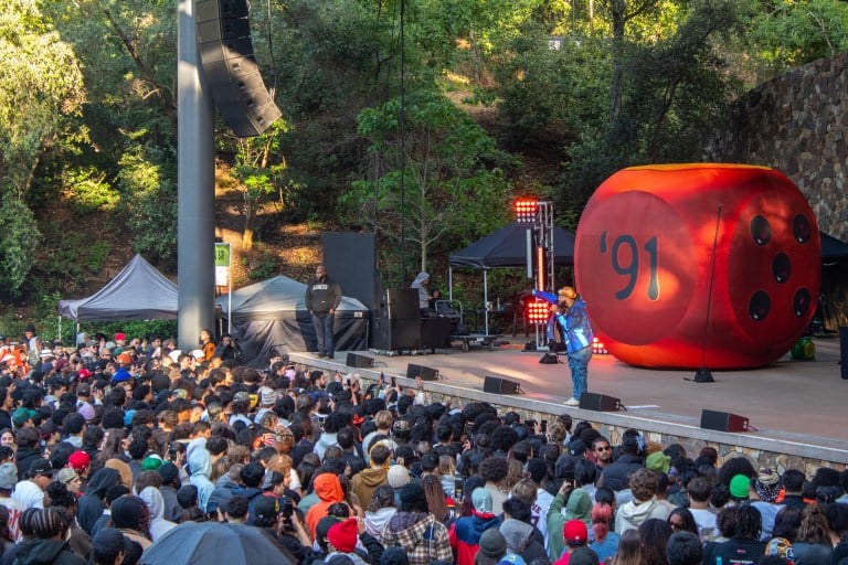 Larry June sings on the Frost Ampitheater stage out to a large crowd.