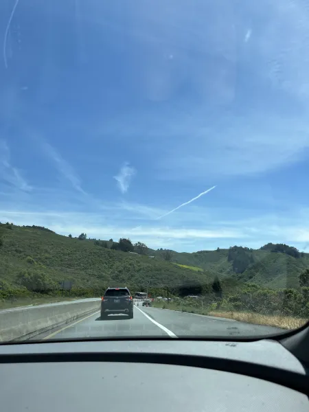 A view from the passenger seat of a car on the California highway.