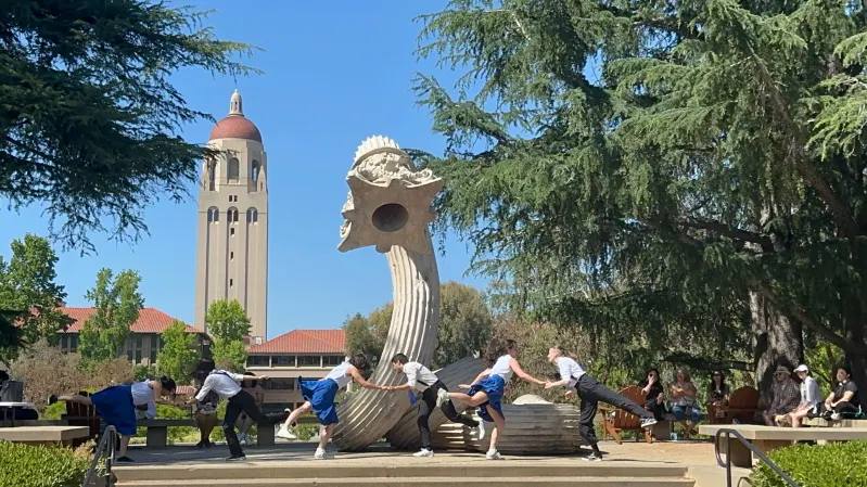 Stanford Swingtime performs in front of the "Hello" statue near Meyer Green
