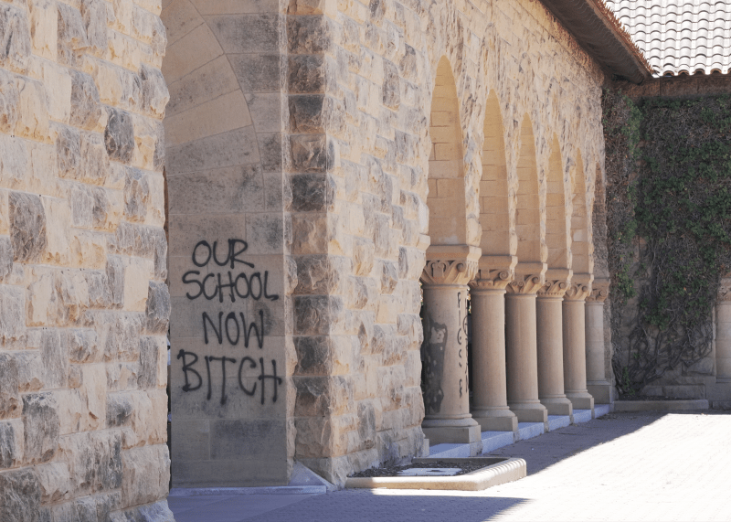 Graffiti in Main Quad that reads "Our School Now Bitch."