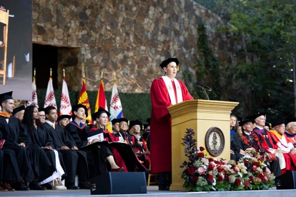 Jonathan Levin speaking at the podium