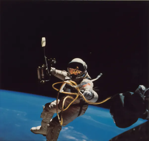 An astronaut floats in space on a spacewalk.