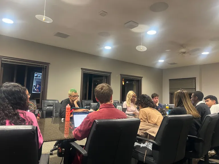 Undergraduate Senators sitting around a table.