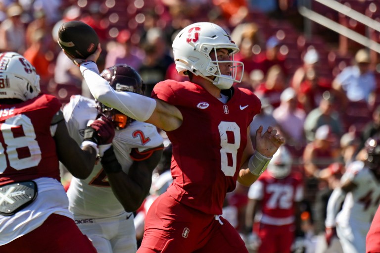 Justin Lamson attempts a pass against Virginia Tech.