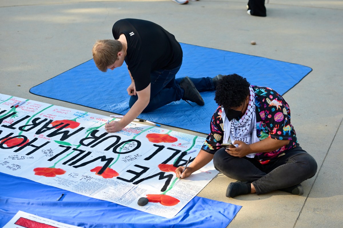 People making art during a pro-Palestine event