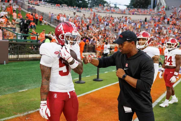 Malcom Agnew and Chris Davis talk before a game against Clemson.