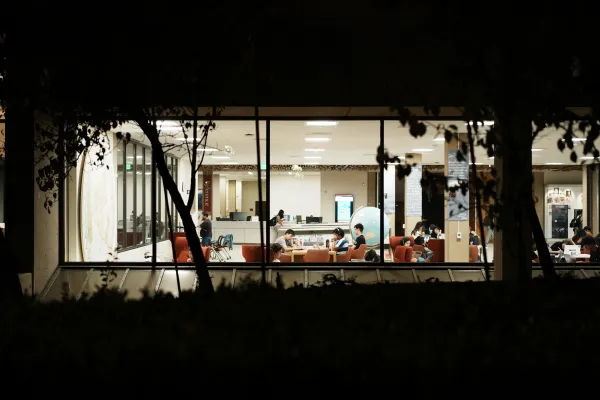 Students study in Green Library at night.