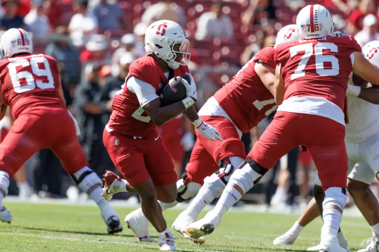 Stanford running back carries the ball during a football game