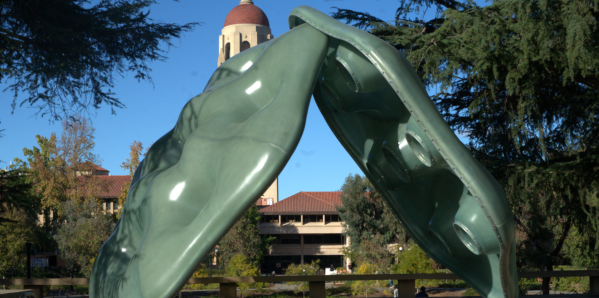 Photo of sculpture "Amulets" in front of Hoover Tower and on Meyer Green.