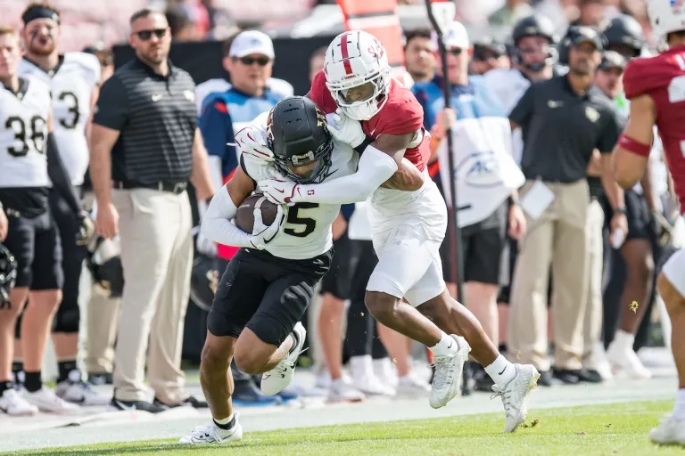 Aaron Morris attempts to take down ball carrier.