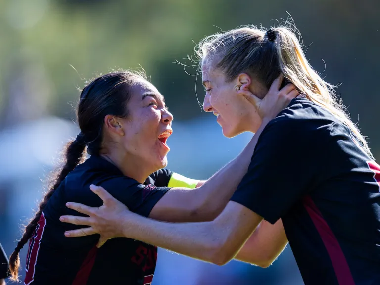 Andrea Kitahata and Shae Harvey celebrate.