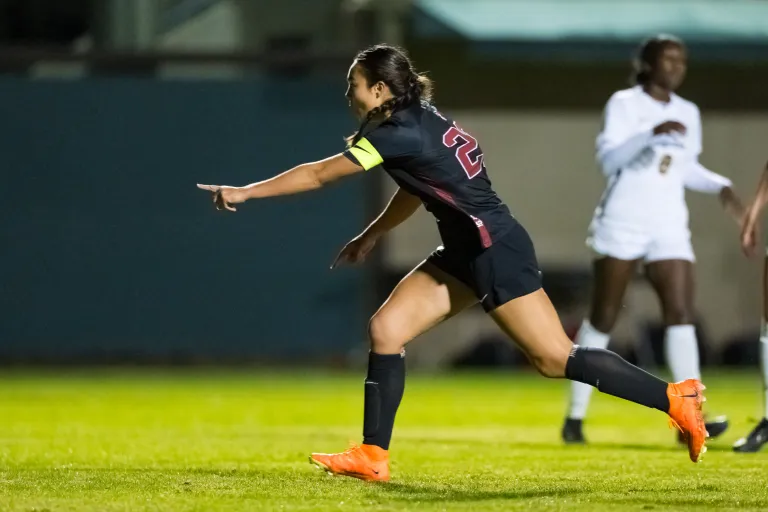 Soccer player running on field.