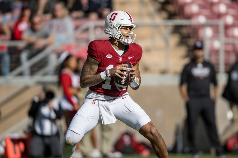 Football player holds ball