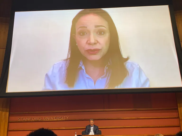 María Corina Machado appears virtually from Venezuela for a conversation with Larry Diamond at an FSI event.