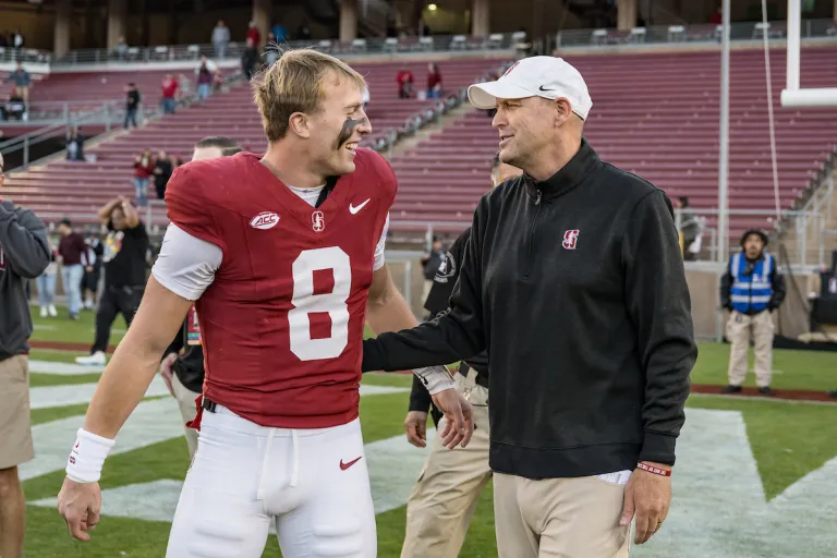 Justin Lamson and head coach Troy Taylor after a game against the University of Louisville. (Photo: KAREN HICKEY/ISI Photos)