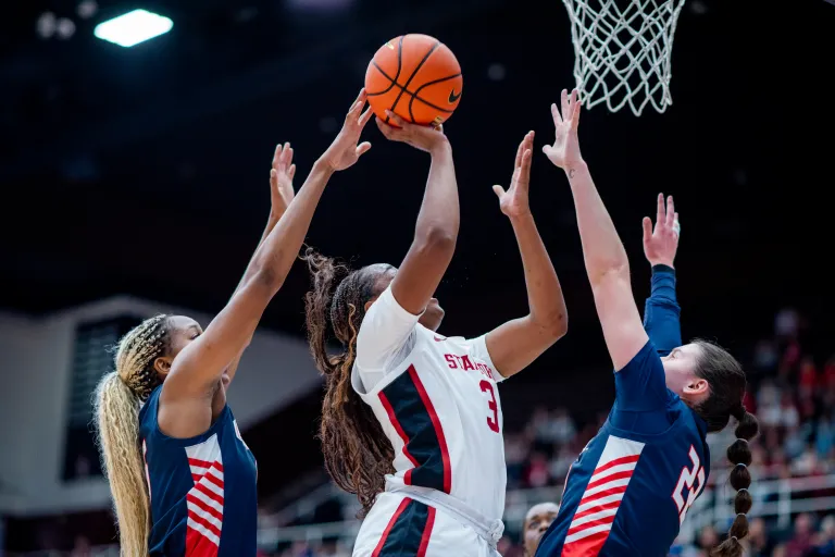 Basketball player going for contested shot