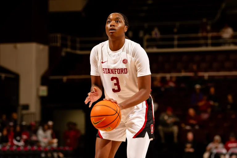 Stanford women's basketball player holds ball at the line.