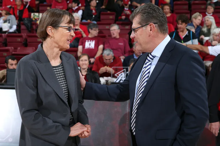 Tara VanDerveer and Geno Auriemma after the Cardinal defeated the Huskies in a 2014 matchup at Maples Pavilion.