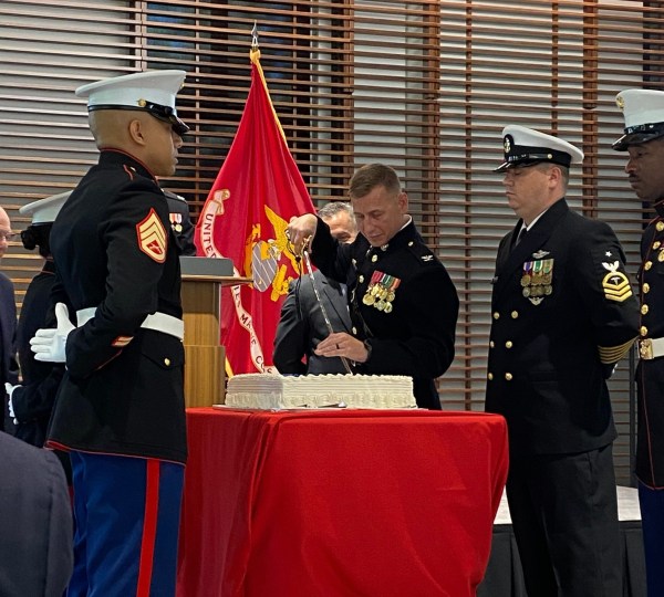 Colonel Greco cutting the Marine Corps birthday cake with Captain Shultz’s mameluke sword