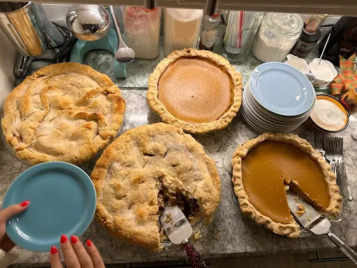 an assortment of pies at the Thanksgiving table