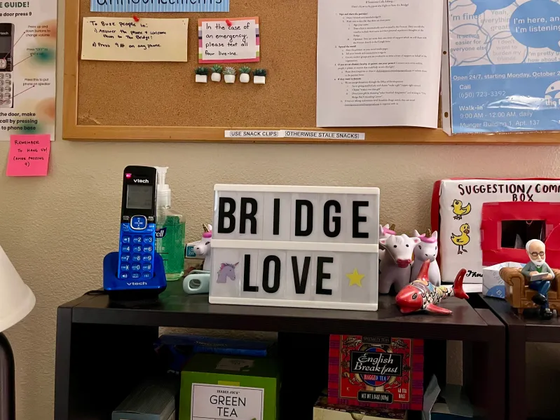 A sign at the Bridge Peer Counseling Center reads "Bridge Love."