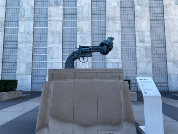 "The Knotted Gun" statue stands in front of the United Nations building in New York City.