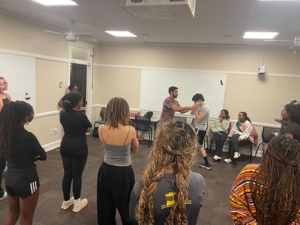 Participants at Pretty Protected, a self-defense workshop hosted by Alpha Kappa Alpha (AKA)’s Xi Beta chapter and the Stanford Boxing Club at Roble Arts Gym Wednesday night. (Photo: YEVA ALLYN/The Stanford Daily)